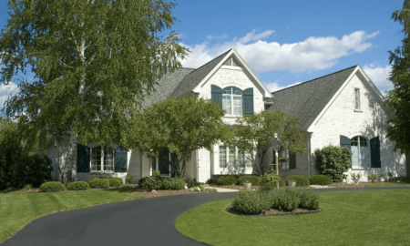 Freshly paved driveway of a suburban home.